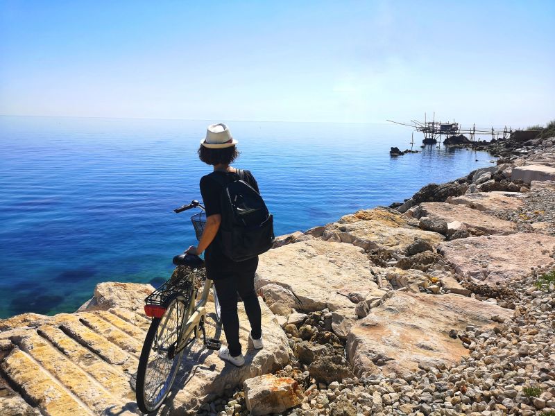 Cycling along Costa Brava coastal cliffside road